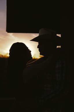 Couple silhouetted at sunset